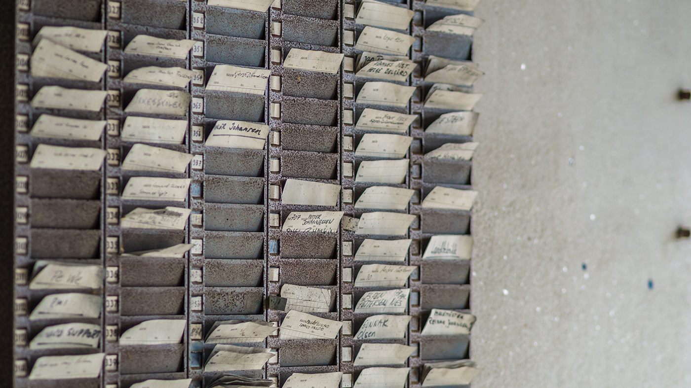 A set of time punch cards, as used by factory workers